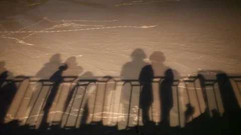 Shadows of moving and static people, hand railing. Ghost image projected on snow Stock Footage 66201600