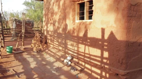 Shadows on a muddy hut Stock Footage 60561156