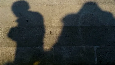 Shadows of the people on a stone wall Video stock 117923504