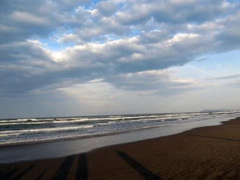 Shadows on sandy beach Stock Photos
