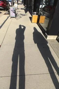 Shadows on the Sidewalk Stock-Fotos