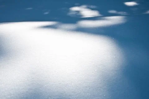 Shadows on the snow surface Stock Photos