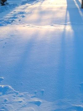 Shadows on the snow surface Stock Photos
