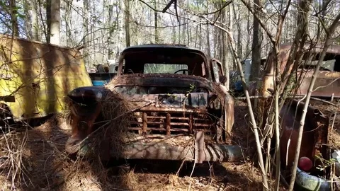 Shadows of trees casting down on old rustic beatup truck Vídeos de archivo 72290221