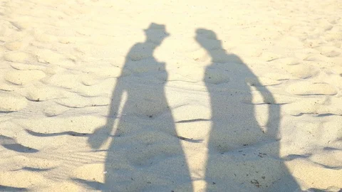 Shadows of two girls dancing on the tropical beach,having fun on a beach party Stock Footage 100199633