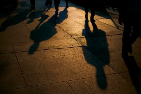 Shadows of walking people Stock-Fotos