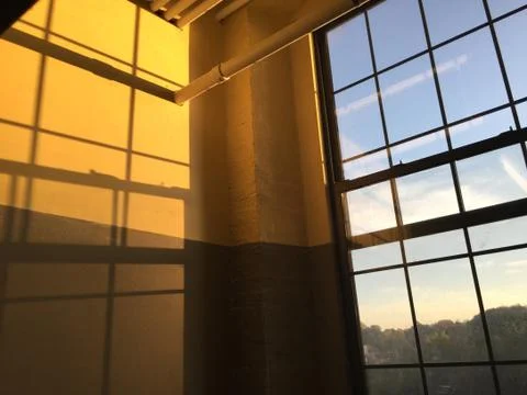 Shadows on a wall at sunset in an office Stock Photos