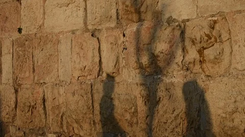 Shadows on the walls of Jerusalem at sunset Stock Footage