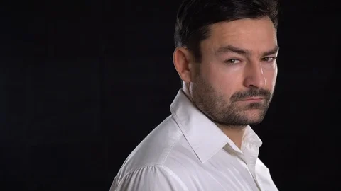Shadowy dark close-up portrait of young good looking male model Stock-Footage 101650990