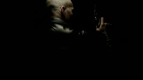 Shadowy Dark Gunman Leather Jacket Stock-Footage 12331624