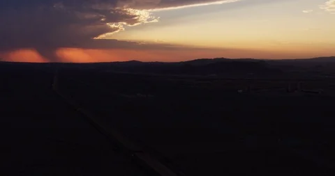 Shadowy mountains and cloudy sunset, aerial Stock Footage 105334408