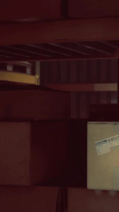 Shadowy stack of boxes resting quietly in a dimly lit storage space Stock Footage 334244241