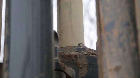 Shaft of giant drill spinning digging well Stock Footage 77278250
