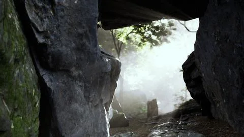 Shaft of light beaming down into large cave Stock Illustration