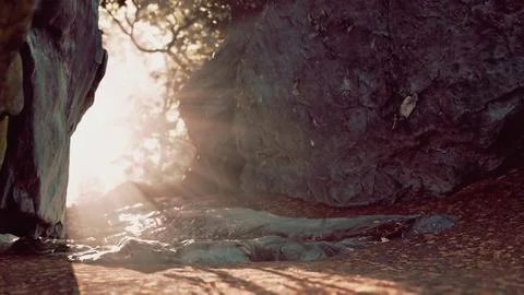 Shaft of light beaming down into large cave Stock Illustration