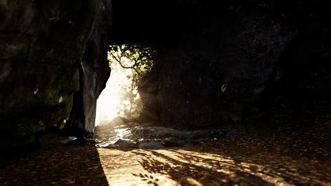 Shaft of light beaming down into large cave 스톡 일러스트