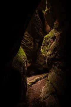 Shaft Of Light Makes Its Way To The Bottom Of Bear Gulch Cave In Pinnacles Stock Photos