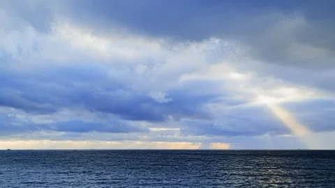 Shafts of sunlight time lapse. Dramatic Sun Rays Breaking Through Clouds Over Stock Footage 340542794