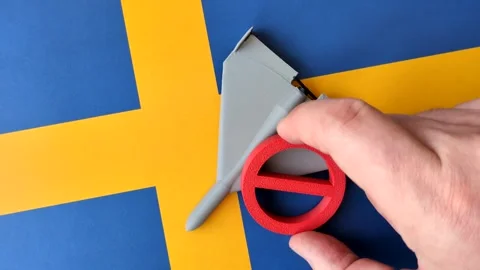 A Shahed drone featuring a prohibition symbol on the Sweden flag, conceptual bac Stock Footage 339440687