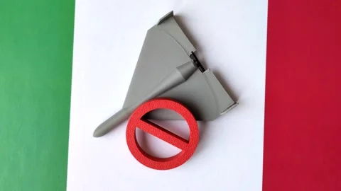 A Shahed drone featuring a prohibition symbol superimposed on the Italian flag Stock Footage 345836464