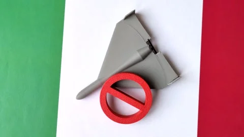 A Shahed drone featuring a prohibition symbol superimposed on the Italian flag Stock Footage 345836468