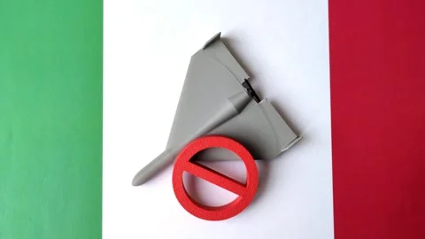 A Shahed drone featuring a prohibition symbol superimposed on the Italian flag Stock Footage 345836477