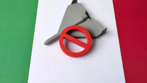 A Shahed drone featuring a prohibition symbol superimposed on the Italian flag Stock Footage 345836480