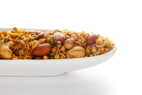 Shahi Mixture in  white ceramic oval bowl, having peanut, cashew, almonds Photos