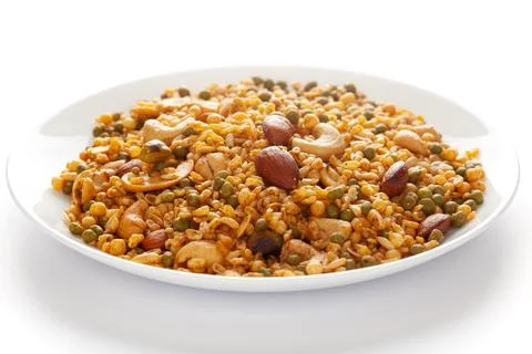Shahi Mixture in  white ceramic plate, having peanut, cashew, almonds Stock Photos