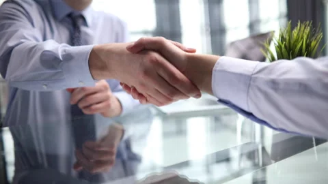 Shake hands after customer signing contract document for ownership realty Stock Footage 249052483