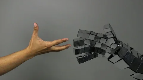 Shake hands with a robot. Stockbeeldmateriaal 91675760