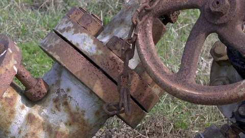 Shaken by the wind rusty chain and old valves Stock-Footage 88257655