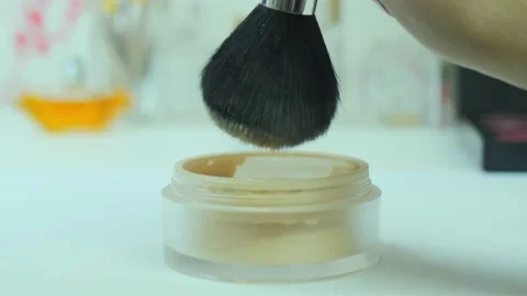 Shakes off the powder from the brush Stock Footage 222022947