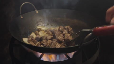 Shaking Beef Cooking in the Wok Stock Footage 1039482