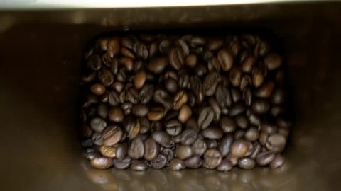 Shaking Coffee Beans in Bowl in Slow Motion Stockbeeldmateriaal 319449422