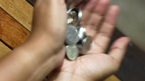 Shaking Coins in Hand Close Up Stock Footage 329452610