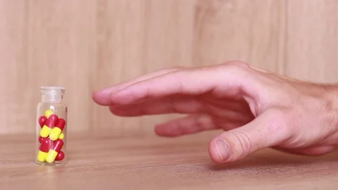 Shaking hand trying to take pills 動画素材 81856888