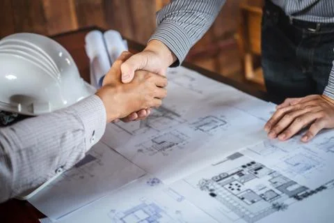 Shaking hands of collaboration, Construction engineering or architect discuss Stock Photos