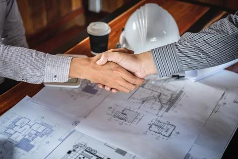 Shaking hands of collaboration, Construction engineering or architect discuss Stock Photos