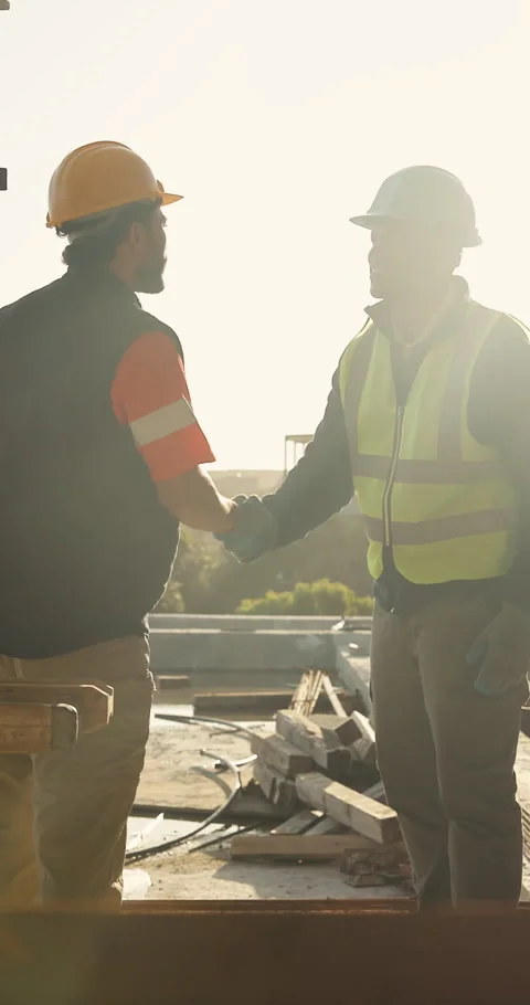 Shaking hands, deal and construction workers on site for city planning, Stock Footage 336781089