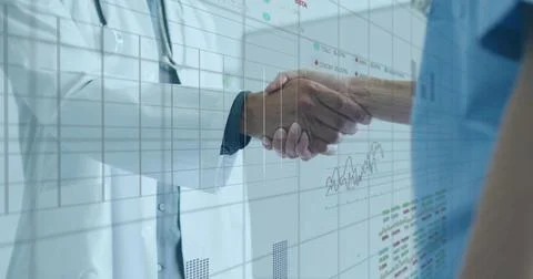 Shaking hands doctors in white lab coat and blue scrubs at clinic, showing Stock Photos