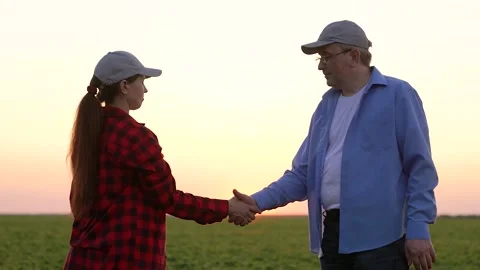 Shaking hands, making deal, teamwork, winning by strength, farming, careful work Stock Footage 259460340