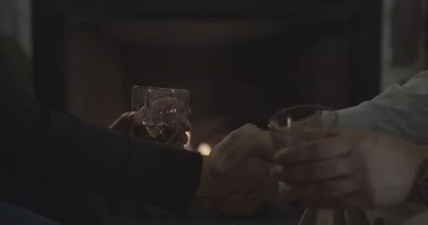 Shaking hands over drinks. Stock Footage 154009573