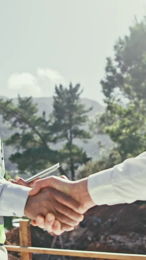 Shaking hands, people and construction workers on site with deal for building Stock Footage 340450859