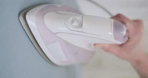 Shaking iron, micro stroking, vertical video. Front view, close-up. Funny iron Stock Footage 234184970