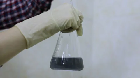 Shaking Liquid Beaker Stock Footage 58264547