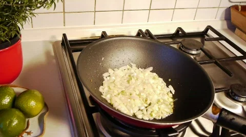 Shaking Onions in Pan Stock Footage 709006