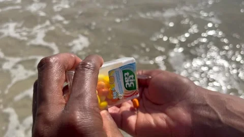 Shaking out some Tic Tacs Stock Footage 308685199