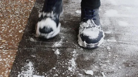 Shaking Off Snow From Boots Stock Footage 85077611