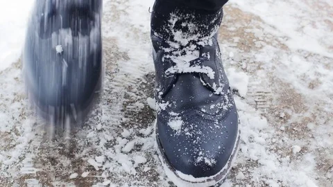 Shaking Snow Off The Boots Stock Footage 85077623